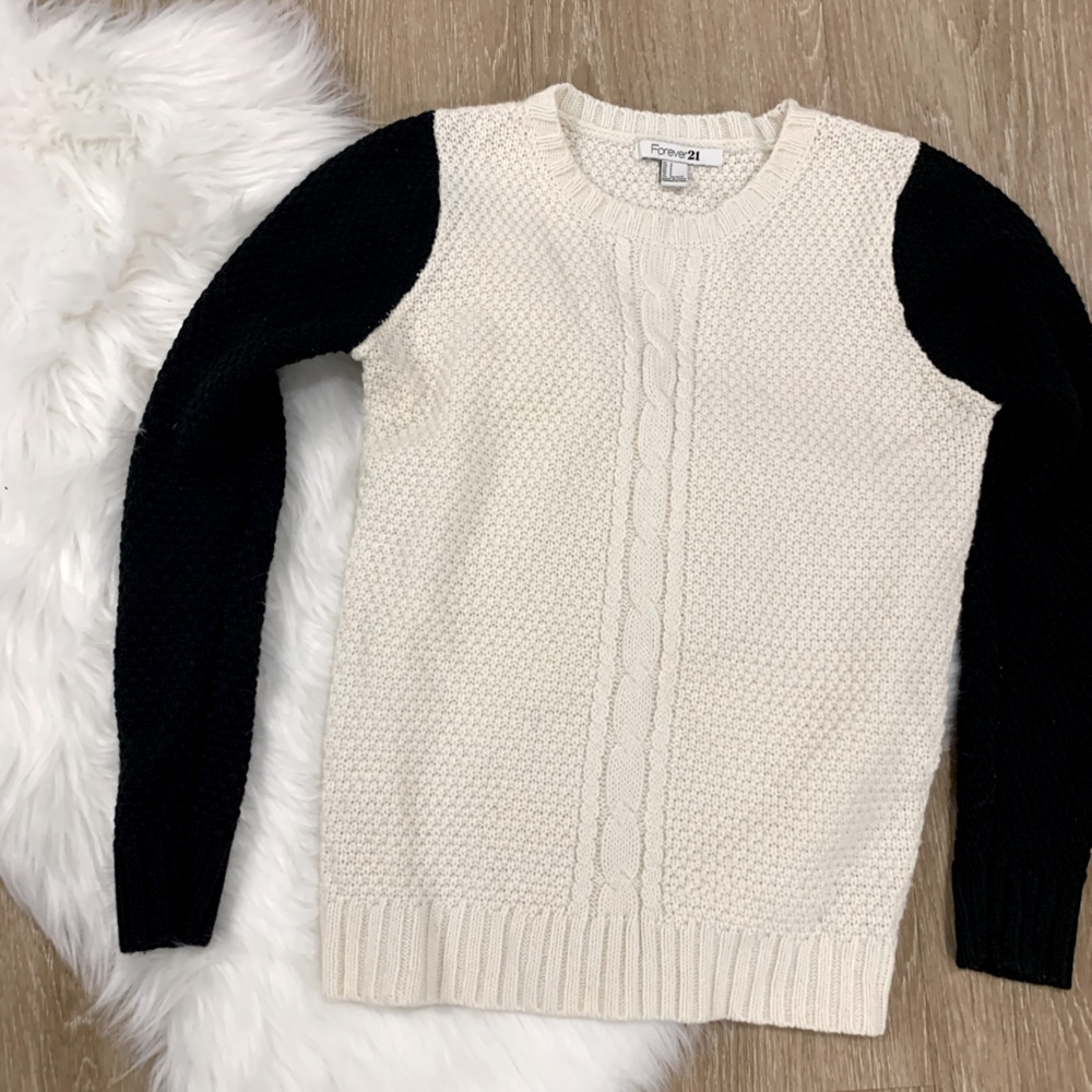 white and black cable knit sweater